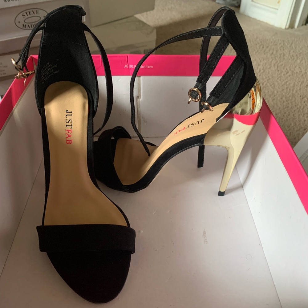 Black and gold heels. Never been worn.